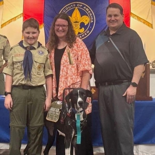 Oreo with their service dog Haven